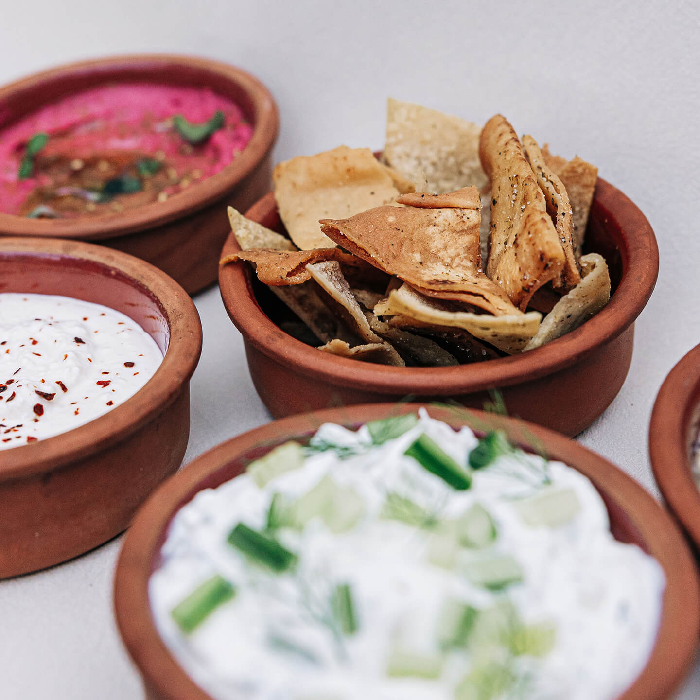 Trio of dips with zaatar pita chips